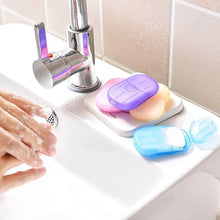 تحميل الصورة في عارض المعرض، Colorful soap containers on a sink with hands washing in the background