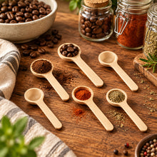 Load image into Gallery viewer, Six light natural wood spoons of different sizes, including two larger spoons shown from the front and four smaller spoons arranged on the side, on a plain white background.