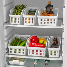 Load image into Gallery viewer, Fridge shelves with white storage baskets containing various food items.