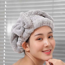 Load image into Gallery viewer, Woman wearing a gray towel on her head with a neutral background
