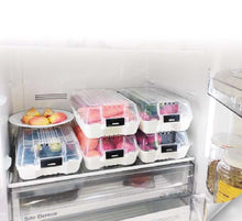 Load image into Gallery viewer, Fridge with organized food storage containers labeled 'dunya'.