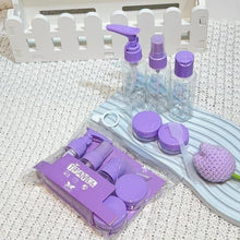 Load image into Gallery viewer, Set of purple-lidded bottles and containers on a textured surface with a white background.