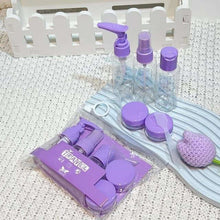 Load image into Gallery viewer, Set of purple-lidded bottles and containers on a textured surface with a white background.