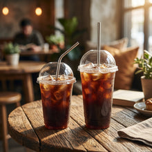 تحميل الصورة في عارض المعرض، Two iced coffee drinks with lids and straws on a white background