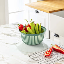 Load image into Gallery viewer, Bowls - Multi Purpose Linea Round Mixing Bowl - ( 3000 ml ) filled with green and red peppers on a kitchen countertop.