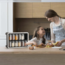 Load image into Gallery viewer, Twelve-jar spice organizer on a kitchen counter during food preparation