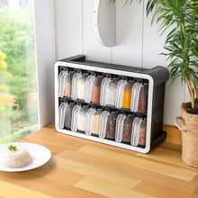 Load image into Gallery viewer, Twelve-jar spice rack beside a window on a wooden counter