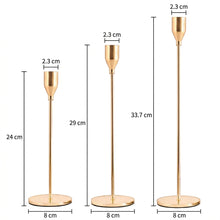 Load image into Gallery viewer, Three gold-toned metal candlestick holders shown on a white background with dimension labels and measurements for height and base width.