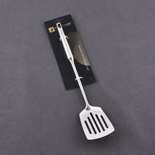 تحميل الصورة في عارض المعرض، Metal spatula with black slits on a dark gray background