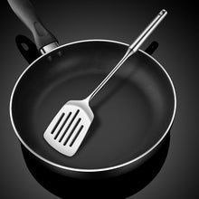 تحميل الصورة في عارض المعرض، Black frying pan with a metal spatula on a dark background