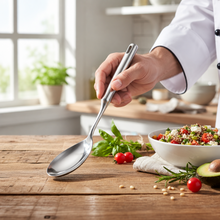 Load image into Gallery viewer, A single stainless steel spoon with a long handle, isolated on a white background.