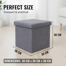 Load image into Gallery viewer, Gray storage ottoman with dimensions labeled on a light wooden floor.
