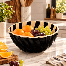 Load image into Gallery viewer, Striped acrylic bowl shown against a green background