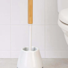 Load image into Gallery viewer, White toilet brush with wooden handle against a tiled bathroom wall.
