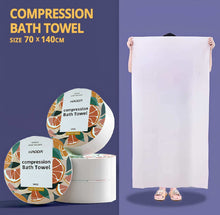 Load image into Gallery viewer, Compression bath towel with packaging and a person holding it on a purple background