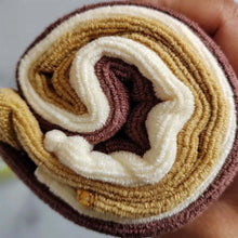 Load image into Gallery viewer, Stack of brown, beige, and white textured towels held in a hand.