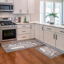 Load image into Gallery viewer, Grey wood-print kitchen mats on a wooden floor beside an oven and white cabinets