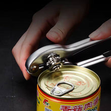 Load image into Gallery viewer, Heavy-duty stainless steel can opener in use, effortlessly opening a can with a non-slip ergonomic handle.