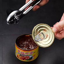 Load image into Gallery viewer, Person using a heavy-duty stainless steel can opener on a canned food container, showcasing ease of use.