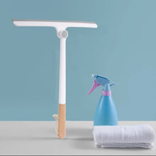 Load image into Gallery viewer, 360° rotating squeegee with wooden handle, cleaning spray bottle and towel on a table against a blue background.