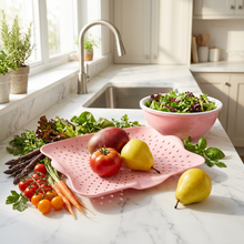 Load image into Gallery viewer, Pink flat colander with fruit on a kitchen counter