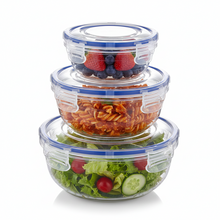 Load image into Gallery viewer, A set of three clear round plastic food storage containers with blue lids, in varying sizes.