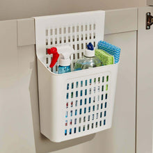 تحميل الصورة في عارض المعرض، A white hanging organizer with a grid-like design, attached to a cabinet door, containing various cleaning supplies.