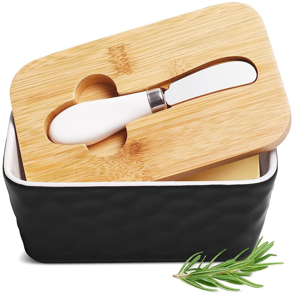 Porcelain butter dish with bamboo lid, silicone sealing ring, and spreader, stylish design for butter storage.