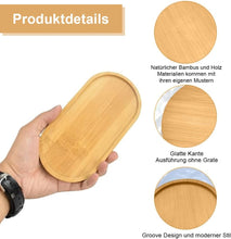 Load image into Gallery viewer, Hand holding a wooden tray with product details on natural bamboo and wood materials, smooth edges, and groove design.
