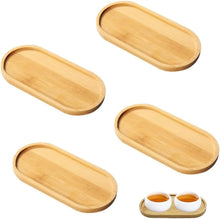 Load image into Gallery viewer, Set of four oval wooden trays on a white background
