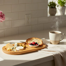 تحميل الصورة في عارض المعرض، Wooden tray with cheese, bread, and berries on a kitchen counter with a steaming cup of coffee.
