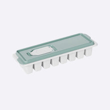 تحميل الصورة في عارض المعرض، Ice cube tray with a green lid on a white background
