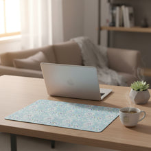 Load image into Gallery viewer, A rectangular mouse pad with rounded corners featuring a light blue and white floral damask pattern, placed on a wooden desk.
