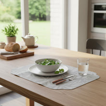 Load image into Gallery viewer, A rectangular mouse pad with rounded corners featuring a light gray and white leaf pattern, displayed on a wooden desk.
