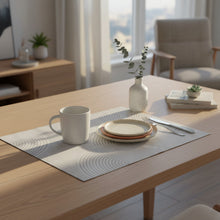 Load image into Gallery viewer, A rectangular sheet of patterned paper with a gray and white geometric wave design, placed on a wooden tabletop.
