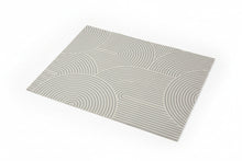 Load image into Gallery viewer, A rectangular sheet of patterned paper with a gray and white geometric wave design, placed on a wooden tabletop.
