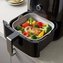تحميل الصورة في عارض المعرض، Black air fryer basket with cooked chicken and vegetables on a kitchen counter.

