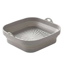 تحميل الصورة في عارض المعرض، Collapsible gray plastic colander on a white background
