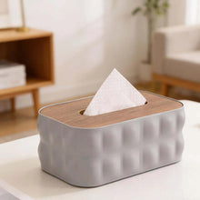 Load image into Gallery viewer, Tissue box with wooden top and gray base on a table in a living room setting
