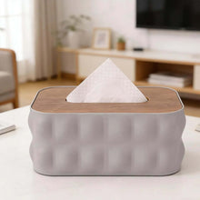 Load image into Gallery viewer, Tissue box with wooden top and wavy gray base on a table in a living room setting.
