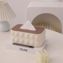 Load image into Gallery viewer, Tissue box on a Celine book with a lamp and decorative item in the background
