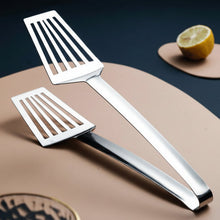 تحميل الصورة في عارض المعرض، Two metal spatulas on a beige surface with a lemon in the background, branded 'dapurnesia'.
