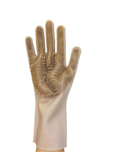 Load image into Gallery viewer, Beige scrubbing glove with textured surface on a white background
