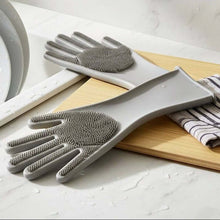 Load image into Gallery viewer, Gray scrubbing gloves with textured surface on a kitchen counter.
