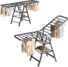 Load image into Gallery viewer, Two metal clothes drying racks with clothes on a white background
