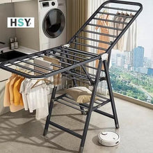 Load image into Gallery viewer, Foldable laundry rack with clothes in a laundry room, HSY brand visible
