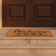 Load image into Gallery viewer, Stack of 'Welcome H.O.M.E' doormats on a green surface
