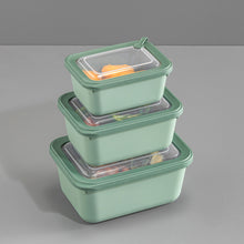تحميل الصورة في عارض المعرض، Set of three green food storage containers with clear lids on a gray background
