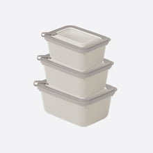 تحميل الصورة في عارض المعرض، Set of three beige storage containers with gray lids on a white background
