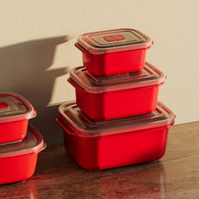تحميل الصورة في عارض المعرض، Set of red food storage containers with clear lids on a wooden surface.
